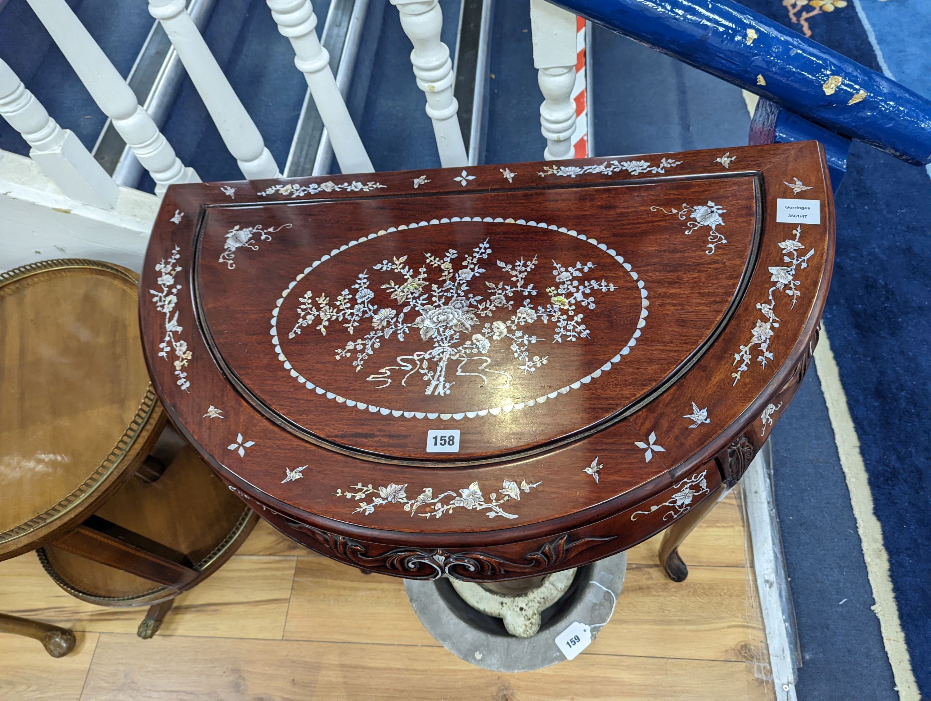 A Chinese hardwood and mother-of-pearl inlaid demi lune side table, width 80cm, depth 45cm, height 76cm